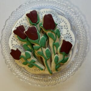 Plate of rose-shaped decorative cookies.