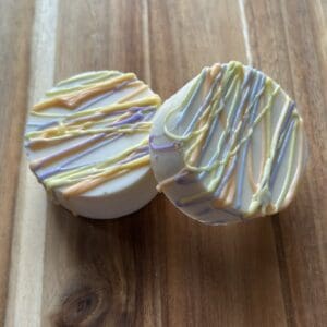 Decorative cookies with colorful icing drizzle.