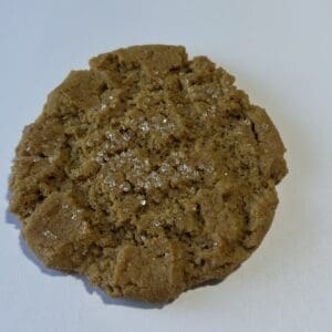 Brown cookie on a white background.