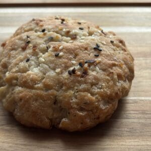 Rustic bread roll with sesame seeds.