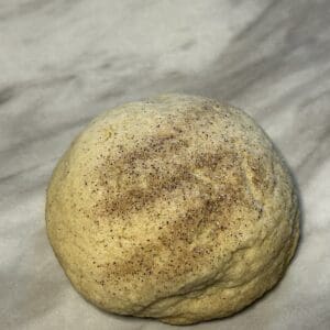 Ball of dough on a marble surface.