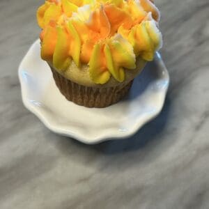 Cupcake with orange and yellow frosting.